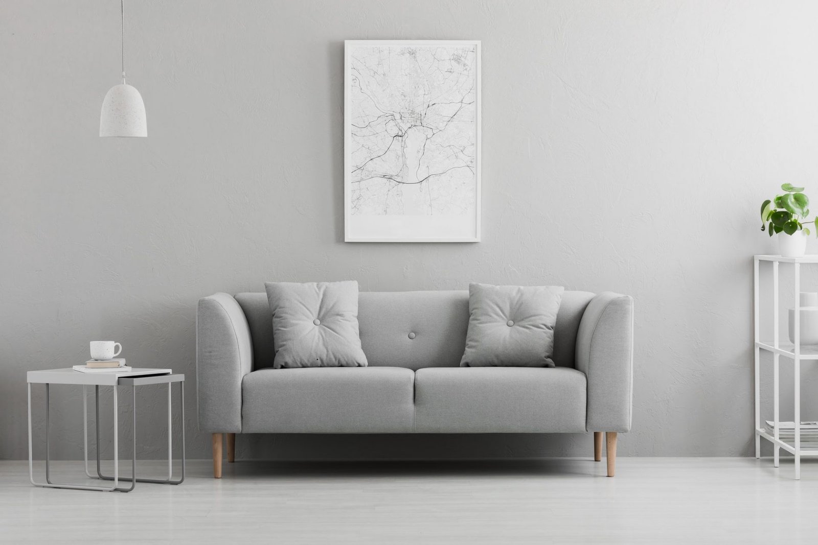 poster-above-grey-couch-in-minimal-living-room-interior-with-lam-e1606471719809